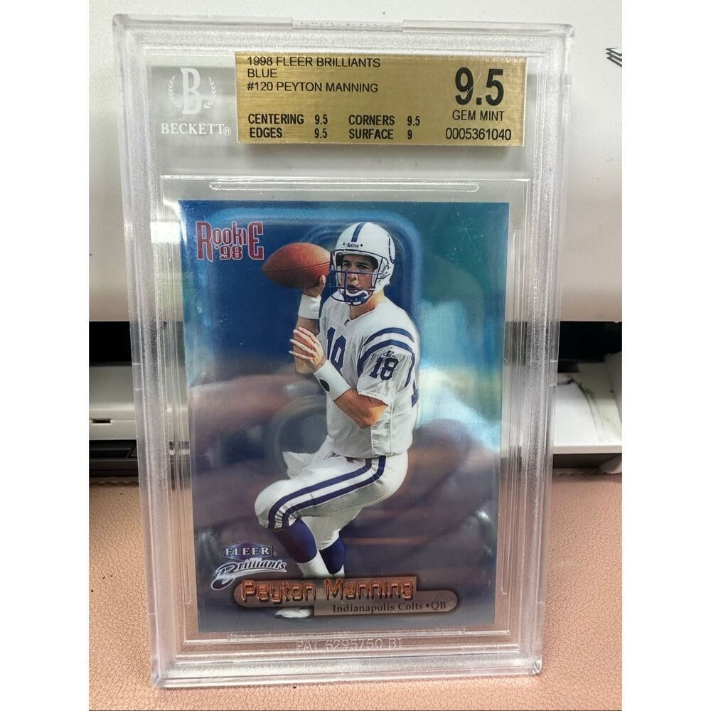 1998 Peyton Manning Fleer Brilliant Blue Rookie card. Beckett 9.5
